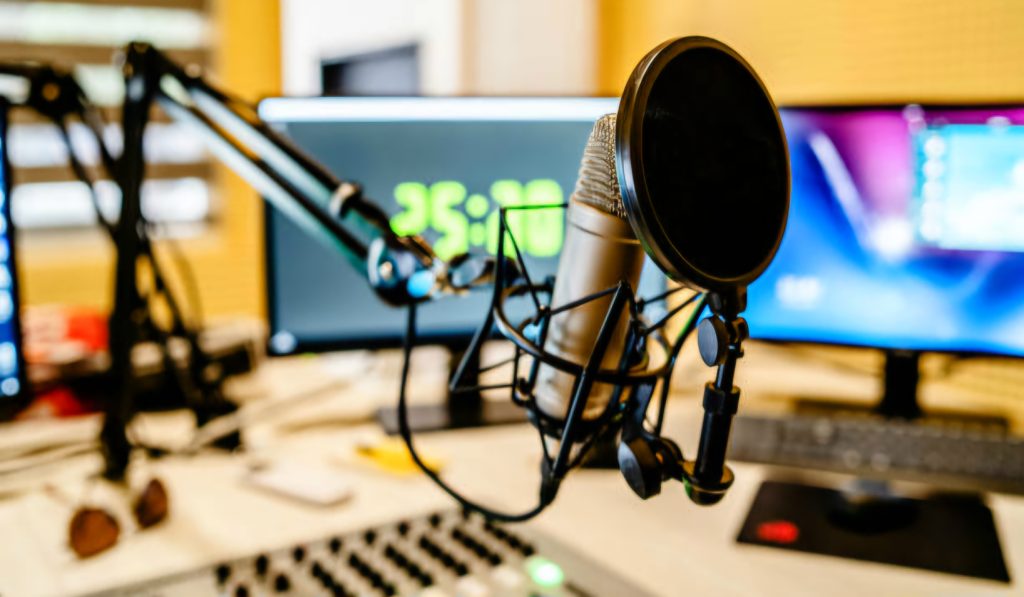 Microphone and mixer at the radio station studio broadcasting news