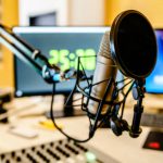 Microphone and mixer at the radio station studio broadcasting news